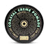 Round black lid labeled “Cream Pomade - Light Hold”—an organic styling cream by Curch California—with “Soft Finish” and descriptive text in a circle, featuring a geometric center design and the brand name at the bottom.