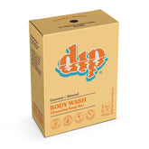 A beige Dip Body Wash Bar labeled "drp" in orange and white features “Coconut + Almond BODY WASH Cleansing Soap Bar.” This eco-friendly Dip product displays weight and vegan, cruelty-free symbols.