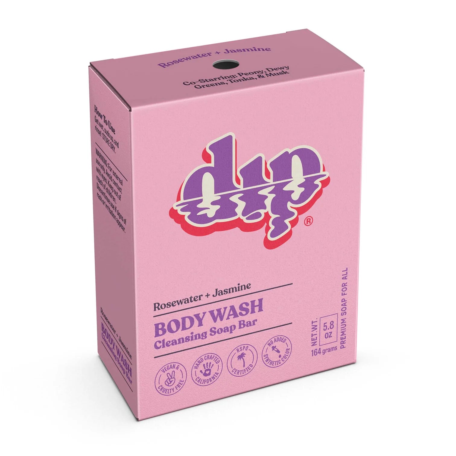 A pink box of Dip Body Wash Bars by Dip in rosewater and jasmine scent, featuring white and purple text and symbols, net weight 5.8 oz (164 g).