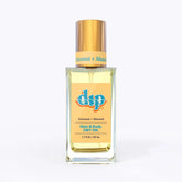 dip hair and body dry oil in a clear bottle with gold lid-coconut almond