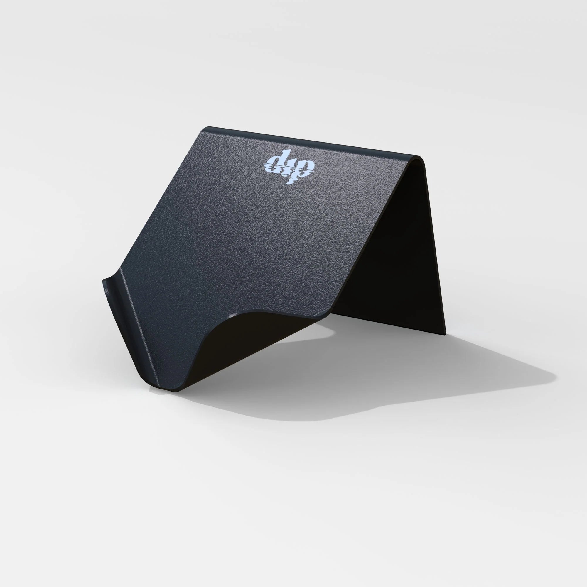 The Dip Life Preserver Draining Soap Dish is a black, minimalist metal holder with a folded design and a small white logo on top, shown on a white background. This durable accessory combines style with eco-friendly materials.