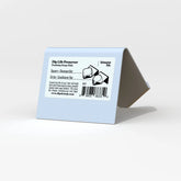 A tent-shaped, light blue, durable Dip Life Preserver Draining Soap Dish features a label with shampoo bar (square) and conditioner bar (circle) icons, noting it&