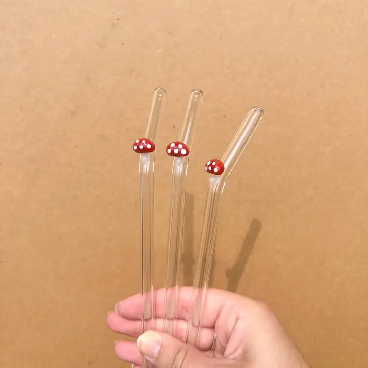 glass straw with red mushroom