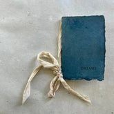 Blue book titled &