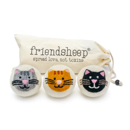 three cat wool dryer ball with one grey cat, one orange cat, one black cat and a cream colored cotton bag with the word Friendsheep on it