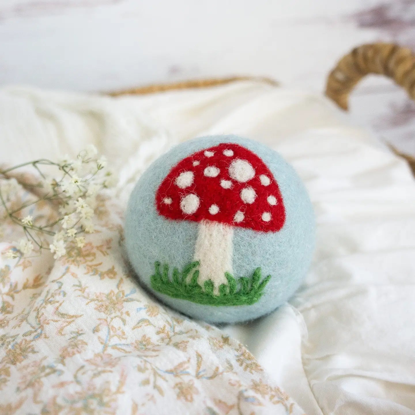 blue wool dryer ball with mushroom
