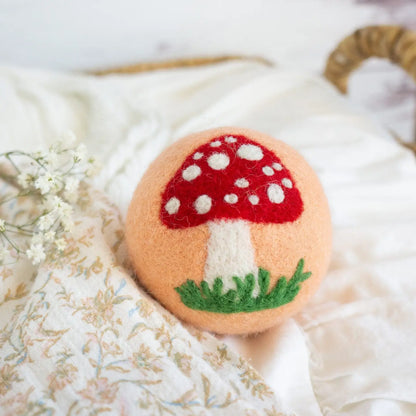 orange wool dryer ball with mushroom
