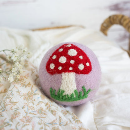 purple wool dryer ball with mushroom
