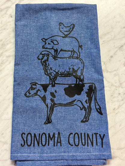 Blue towel with animal illustrations and &