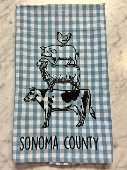 Checkered towel with farm animal illustrations and &