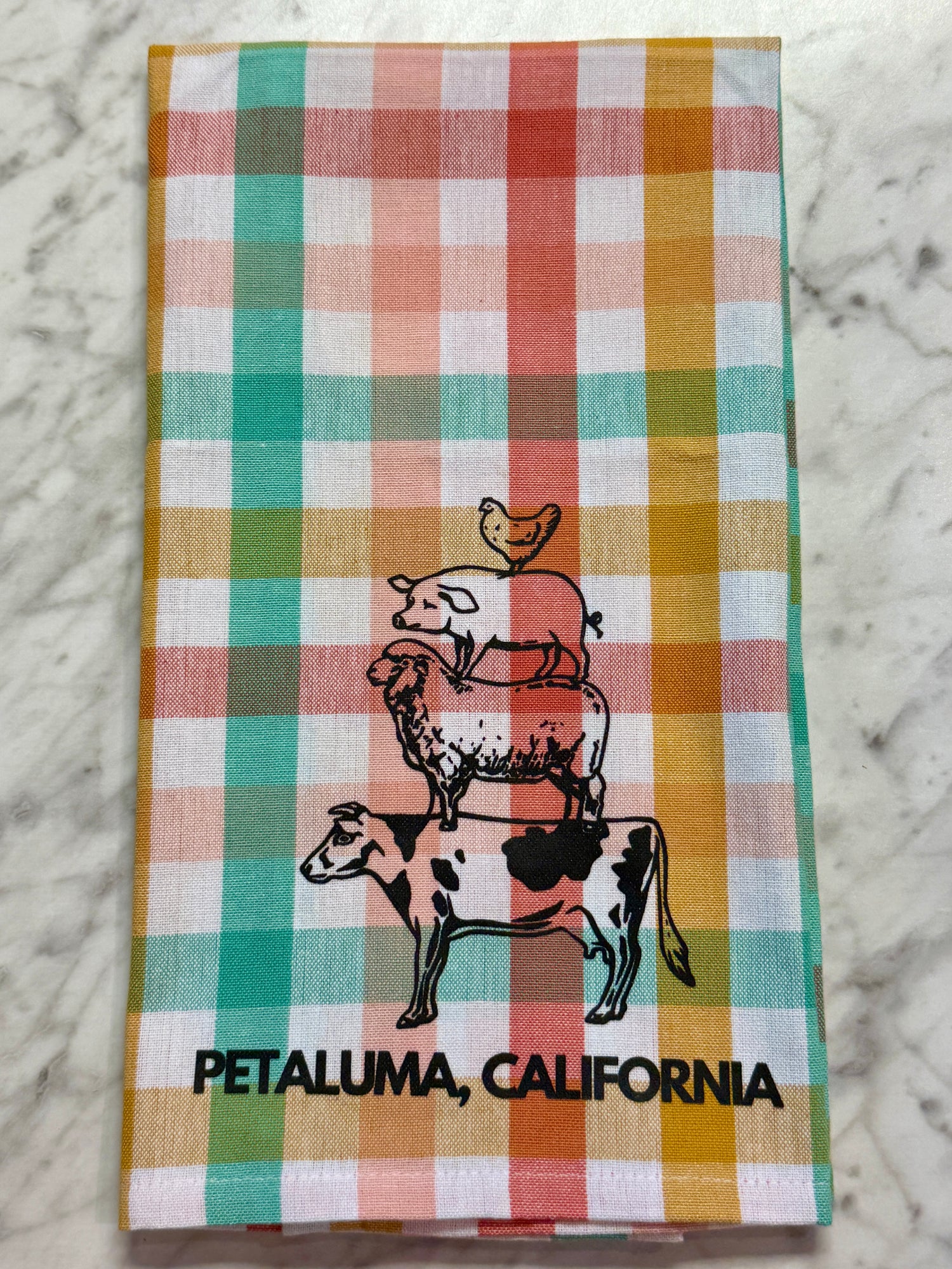 Checkered towel with animal illustrations and &