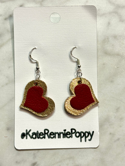 Heart-shaped earrings on a card with &