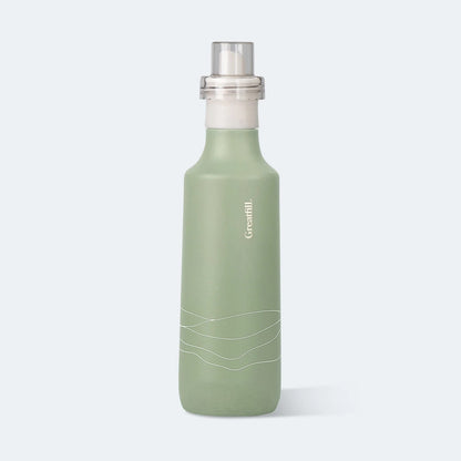 Green bottle with silver cap on a white background