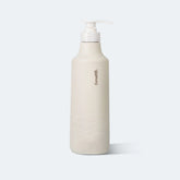 Beige bottle with pump on a light gray background