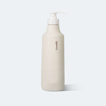 Beige bottle with pump on a light gray background