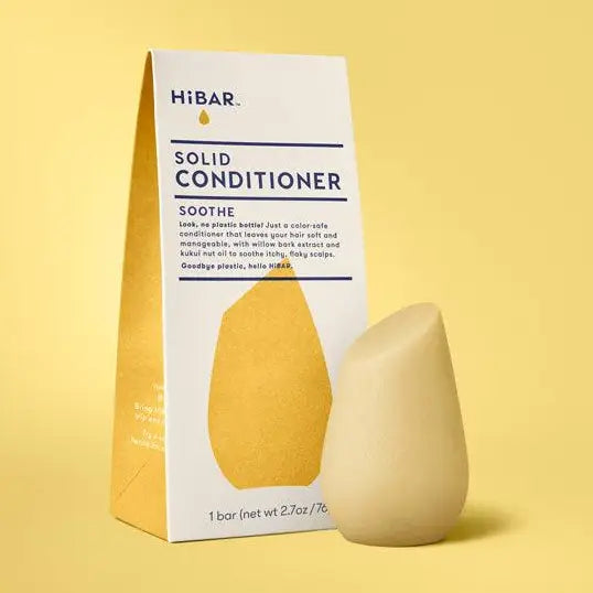 Solid conditioner bar and packaging on a yellow background