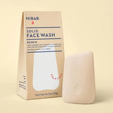 HiBAR solid face wash packaging and bar on a beige background