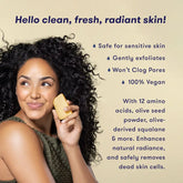 Woman holding a bar of hibar soap with text about skin care benefits on a beige background