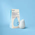 Solid shampoo bar with packaging on a blue background