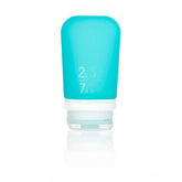 The Humangear GoToob+ is a small blue 2.5 fl oz (74 ml) refillable silicone travel bottle with a white flip-top cap, featuring a leak-proof design ideal for packing essentials.
