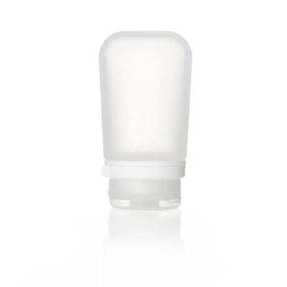 The Humangear GoToob+ is a translucent, empty silicone travel bottle with a white screw-on cap, standing upright against a plain white background—perfect as a leak-proof travel container.