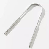 chrome tongue scraper with white background