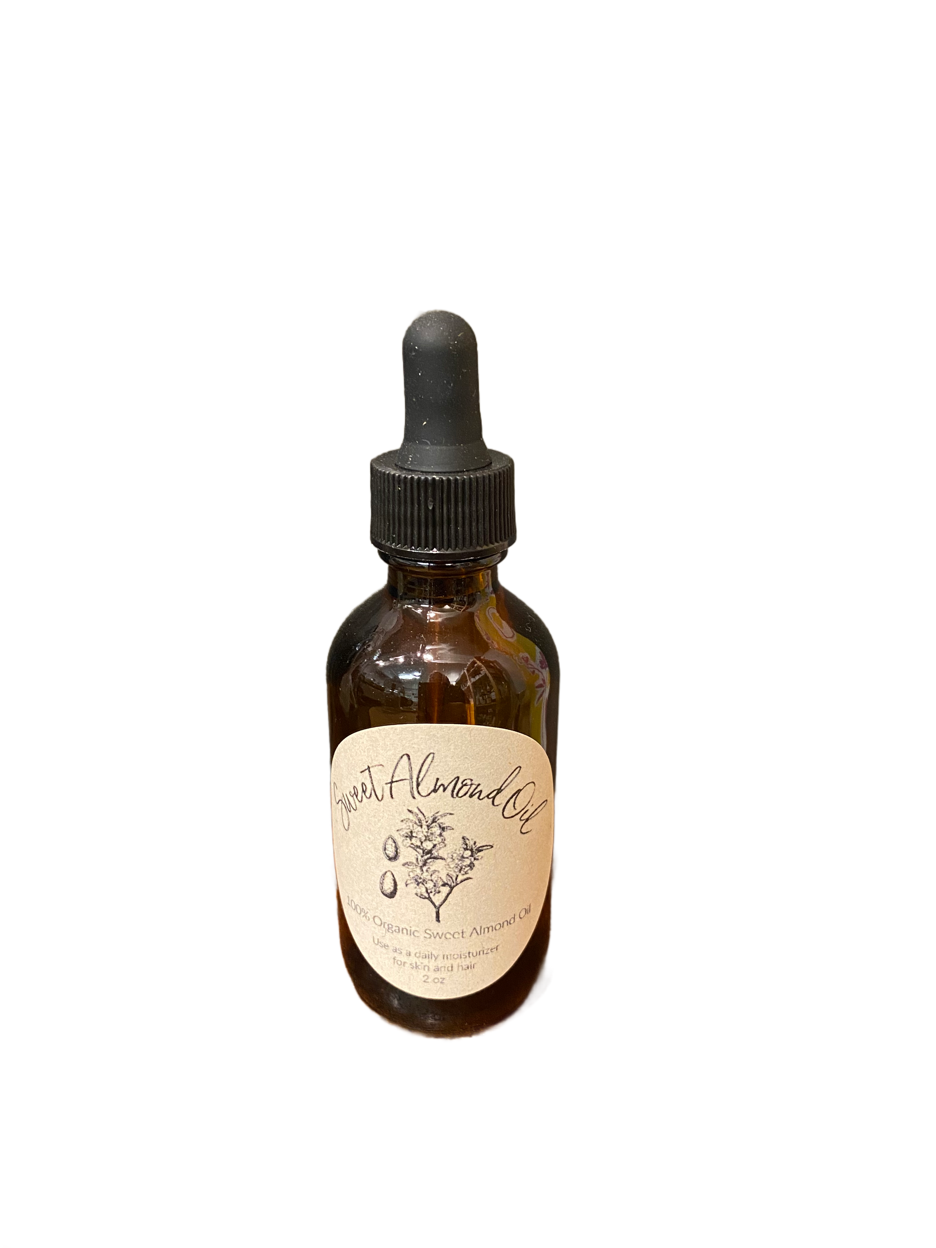 A 2 oz brown glass dropper bottle of Refill Mercantile Sweet Almond Oil with a beige label and black text, set against a plain white background—ideal as a carrier oil for aromatherapy or skincare.