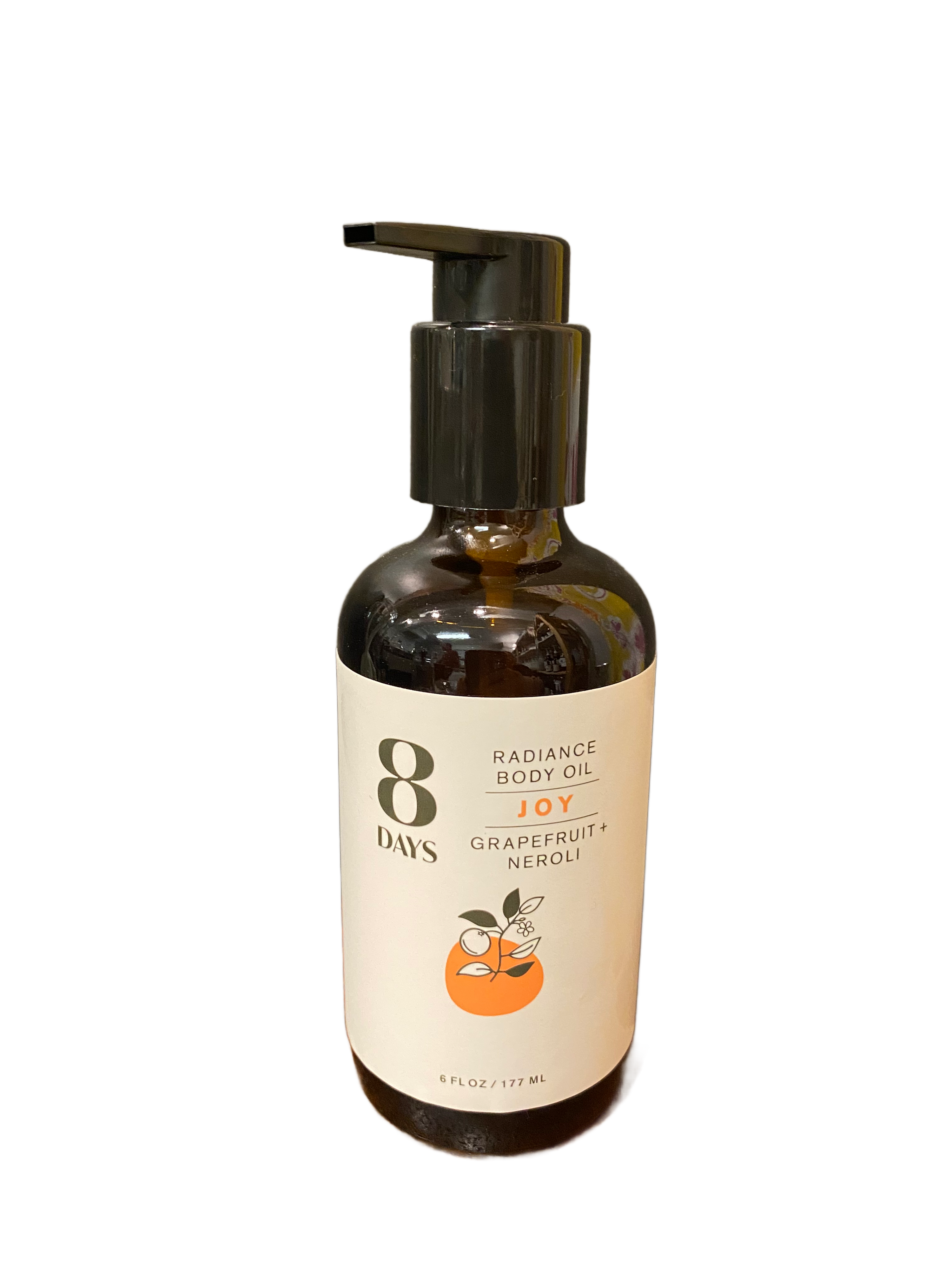 A dark brown pump bottle labeled 8 Days Botanicals Body Oil, Joy scent with grapefruit and neroli, displays two oranges on the front. This 6 fl oz (177 ml) body oil provides aromatherapy benefits.