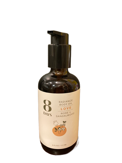 A dark amber pump bottle of 8 Days Botanicals Body Oil, 6 fl oz (177 ml), features a floral illustration and offers aromatherapy benefits for glowing skin with love, rose, and sandalwood.