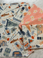 Four Not Paper Towels Bundles by Sustainable For Good rest on marble: three feature camping-themed designs with fish, butterflies, cameras, and tents; the fourth is pink with daisies—eco-friendly reusable cloths for cleaning.