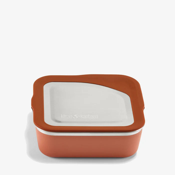 The Klean Kanteen Stainless Steel Lunch Box 23 oz is a square, rust-colored reusable container with a matching lid featuring a translucent white window, shown on a plain white background.