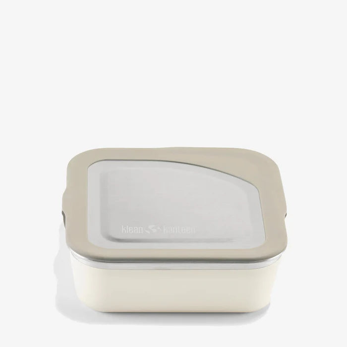 The Klean Kanteen Stainless Steel Lunch Box 23 oz features a square, cream-colored body with a light gray lid and clear top window, displayed against a white background.
