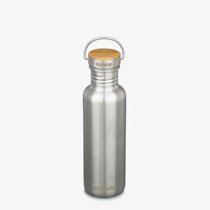 A minimalist, plastic-free Klean Kanteen Stainless Steel Water Bottle - 27 oz with a wooden cap and metal handle stands upright on a plain white background, showing the brand name near the bottom and on the lid.