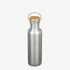 A minimalist, plastic-free Klean Kanteen Stainless Steel Water Bottle - 27 oz with a wooden cap and metal handle stands upright on a plain white background, showing the brand name near the bottom and on the lid.