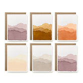 Set of six greeting cards with gradient mountain designs on a white background