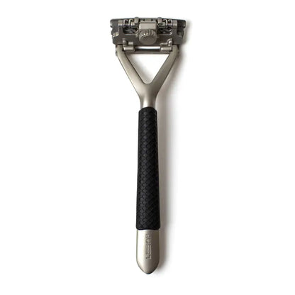 The Leaf Razor Accessories by Leaf include a metal safety razor with a textured black handle and detachable multi-blade cartridge head, ideal for use with single edge blades and a blade recycling tin for an eco-friendly shave.