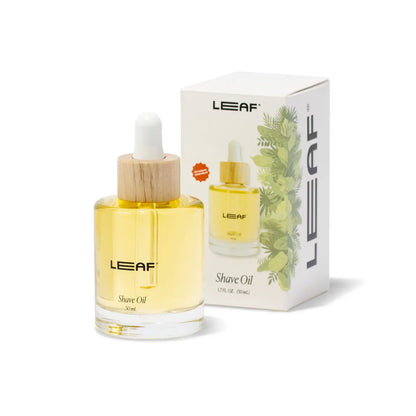 leaf shave oil in a glass dropper bottle with wood in front of the box