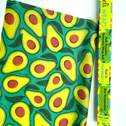beeswax wrap roll. green with the inside of avocados as the print.