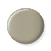 Round beige nail polish sample  on a white background