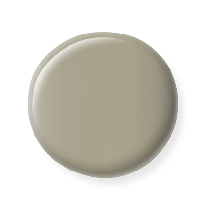Round beige nail polish sample  on a white background