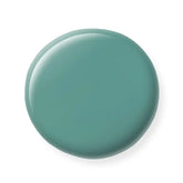 Teal-colored nail polish sample on a white background