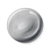 Round metallic nail polish sample on a white background