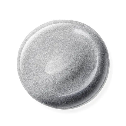 Round metallic nail polish sample on a white background