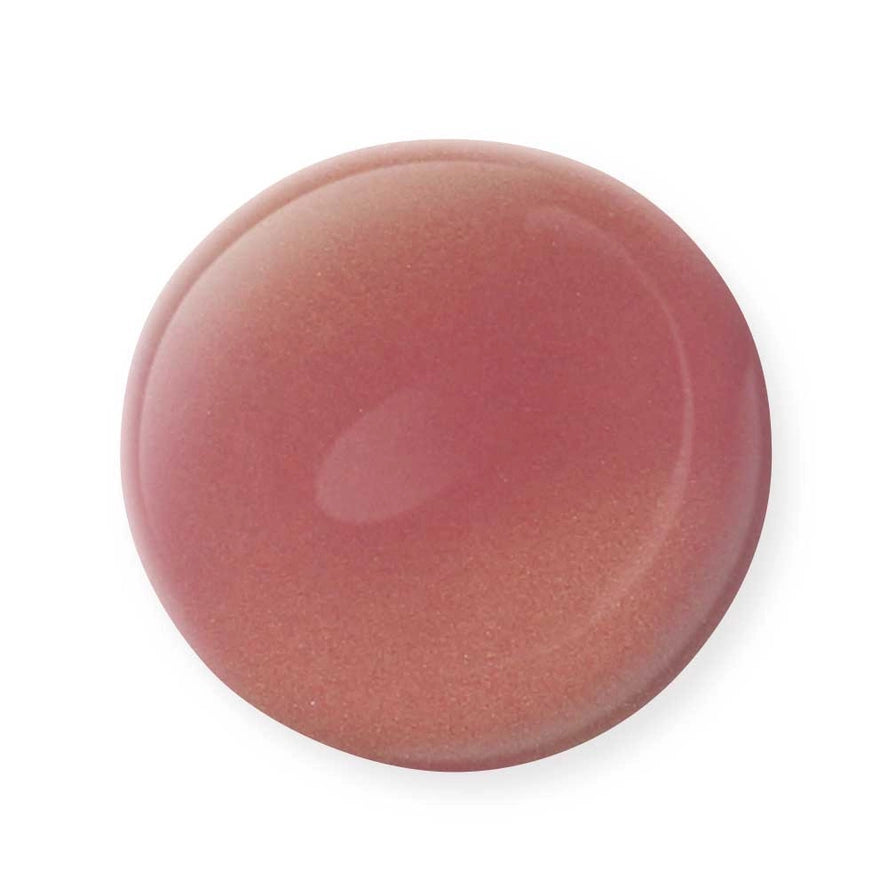 A round drop of shimmery, mauve-pink Mineral Fusion Nail Polish by Mineral Fusion with a glossy finish stands out against a white background—ideal for anyone seeking clean beauty and non-toxic nail polish options.