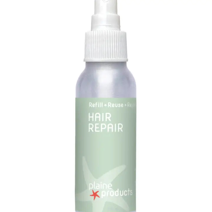 small aluminum bottle with green label and white spray pump top