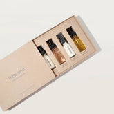 rebrand minis kit with box slightly open showing all 4 refillable bottles