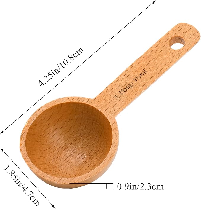 The Refill Mercantile Tablespoon Measuring Spoon is food grade wood, 4.25" long, 1.85" wide, and 0.9" deep. The handle is marked "1 Tbsp 15ml," making it perfect for baking or as a laundry soap scoop.