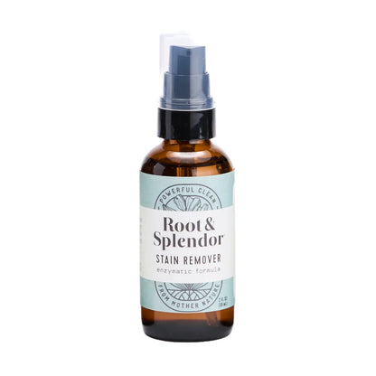 A brown spray bottle of Root and Splendor Laundry Pre-Spotter Stain Remover with a blue and white label and clear cap—an eco-friendly, enzymatic formula to naturally tackle tough laundry stains.
