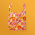 retro daisy flowers on a reusable tote bag