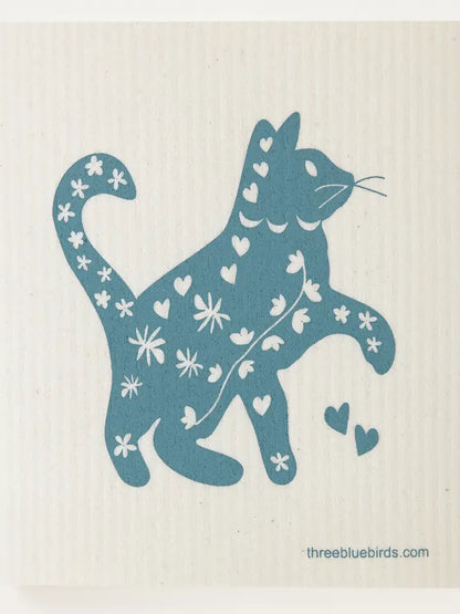 Blue cat design with floral and heart patterns on a beige background, featuring &